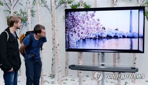 LG三星等家电巨头加盟韩国购物旅游体验节，图为LG电子的OLED TV ------中韩人力网。
